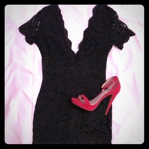 Black lace mini dress with plunging neckline